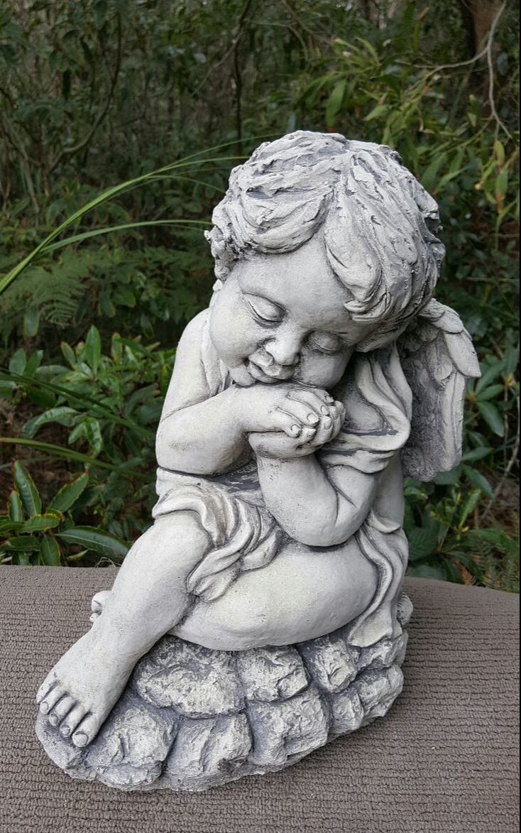 Cherub Resting On Hands